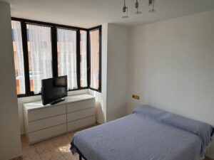Dormitorio del apartamento las olas en el paseo marítimo de Corralejo